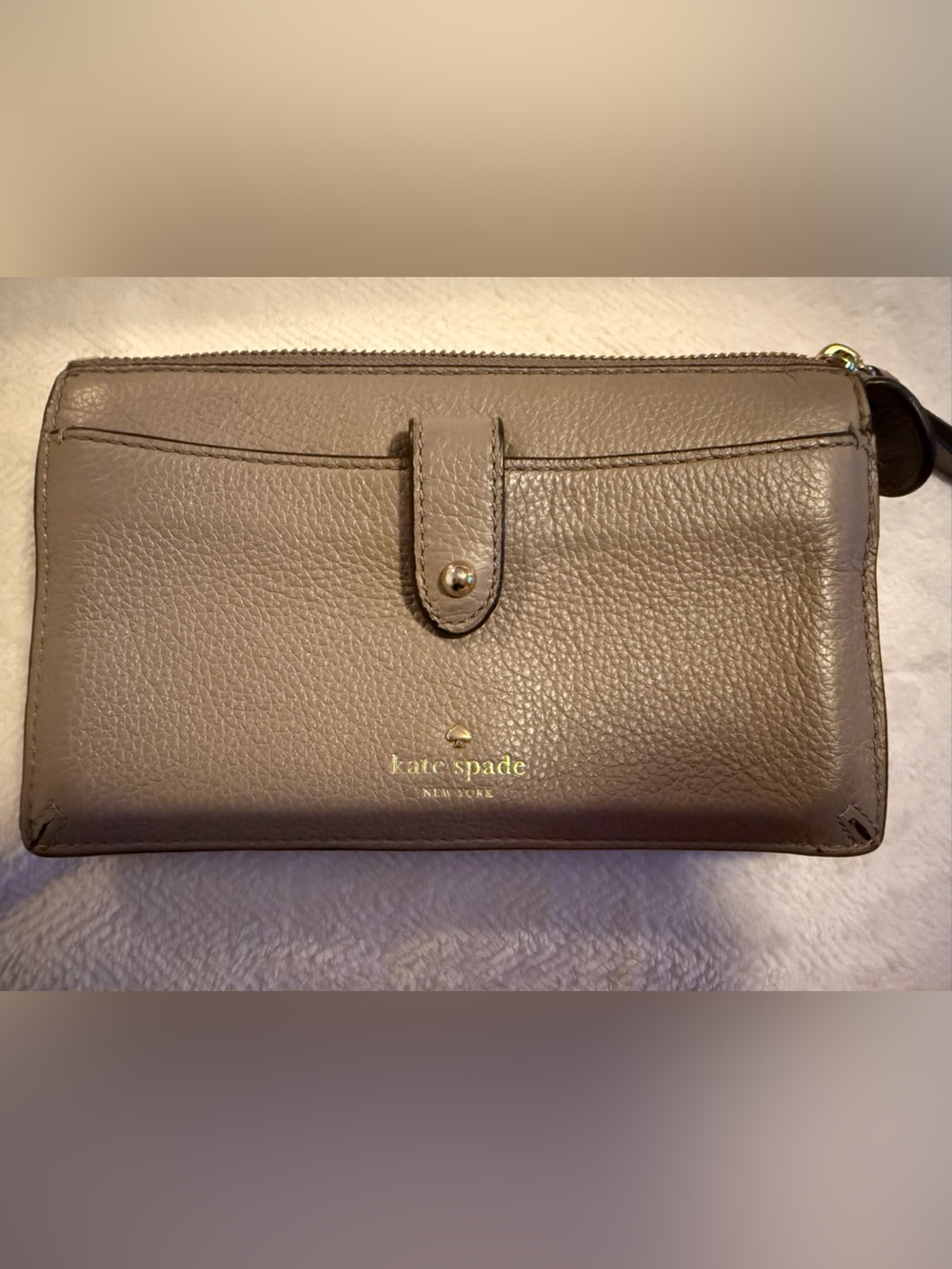 kate spade pebble leather wallet in taupe